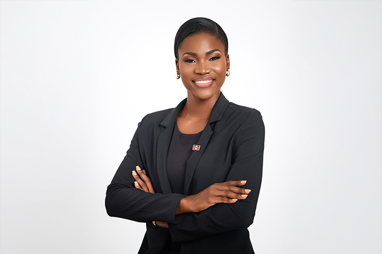head and shoulders picture of a black woman in dark coloured suite