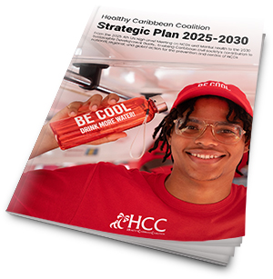 A smiling person in a red shirt and cap holds a red bottle labeled BE COOL DRINK MORE WATER. The cover text reads Healthy Caribbean Coalition Strategic Plan 2025-2030.